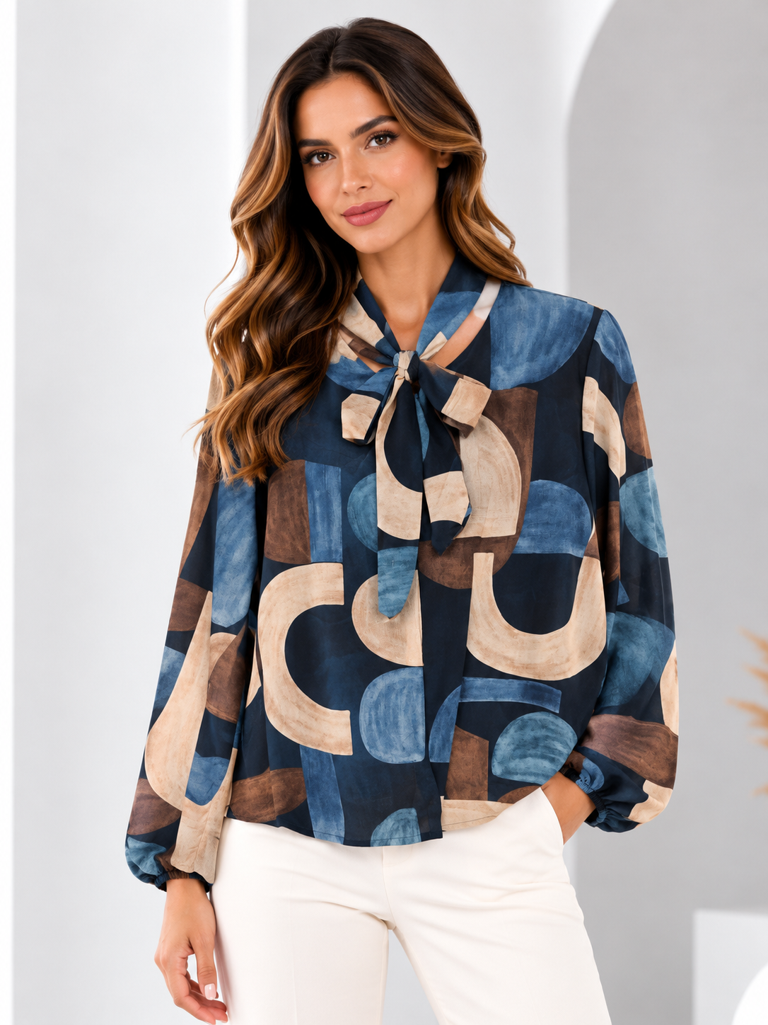 Model wearing the geometric bow-neck blouse in Blue