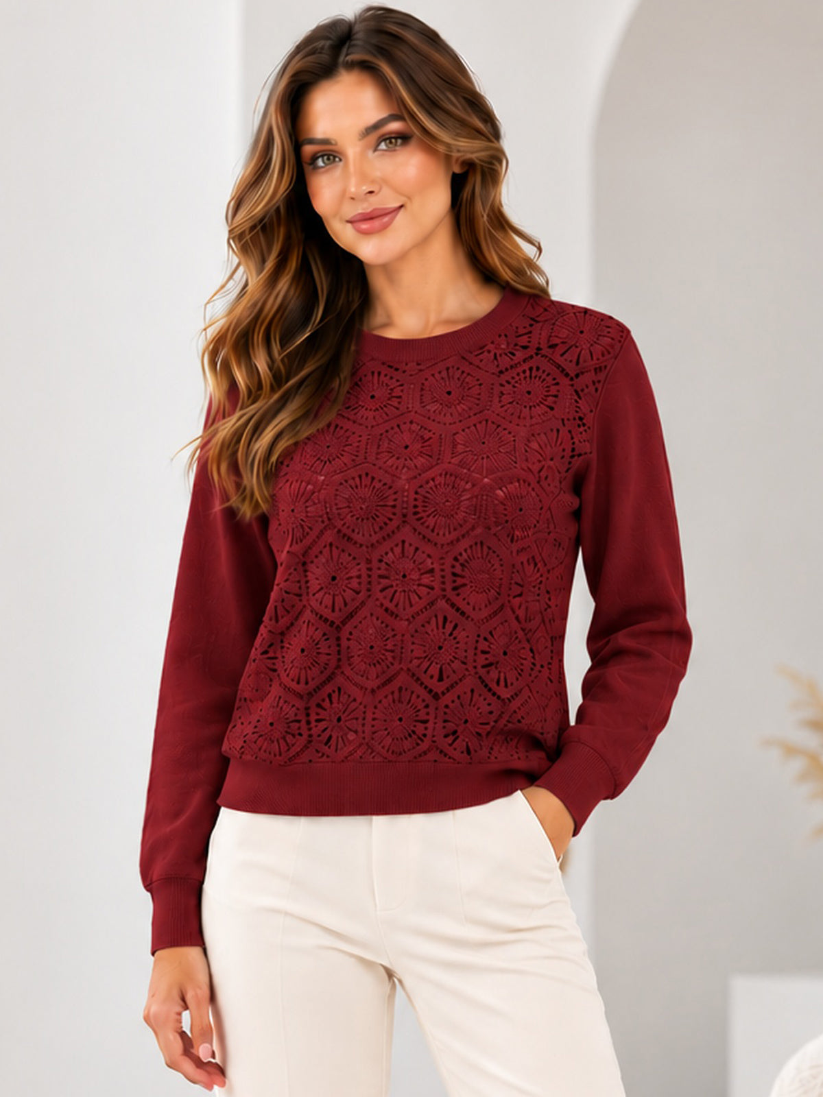Model wearing the floral lace knit top in Burgundy